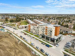 Main Photo: 209 71 Shawnee Common SW in Calgary: Shawnee Slopes Apartment for sale : MLS®# A2129391