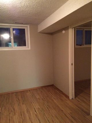 Photo 13: 7112 54 Avenue NW in Calgary: Silver Springs Semi Detached (Half Duplex) for sale : MLS®# A2019304