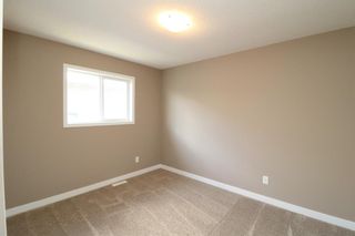 Photo 15: 419 Henricks Drive: Irricana Semi Detached (Half Duplex) for sale : MLS®# A1225048