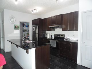 Photo 4: 9 NOLANFIELD Lane NW in Calgary: Nolan Hill Detached for sale : MLS®# A2052514