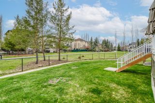 Photo 27: 42 Crystal Shores Cove: Okotoks Row/Townhouse for sale : MLS®# A1218306