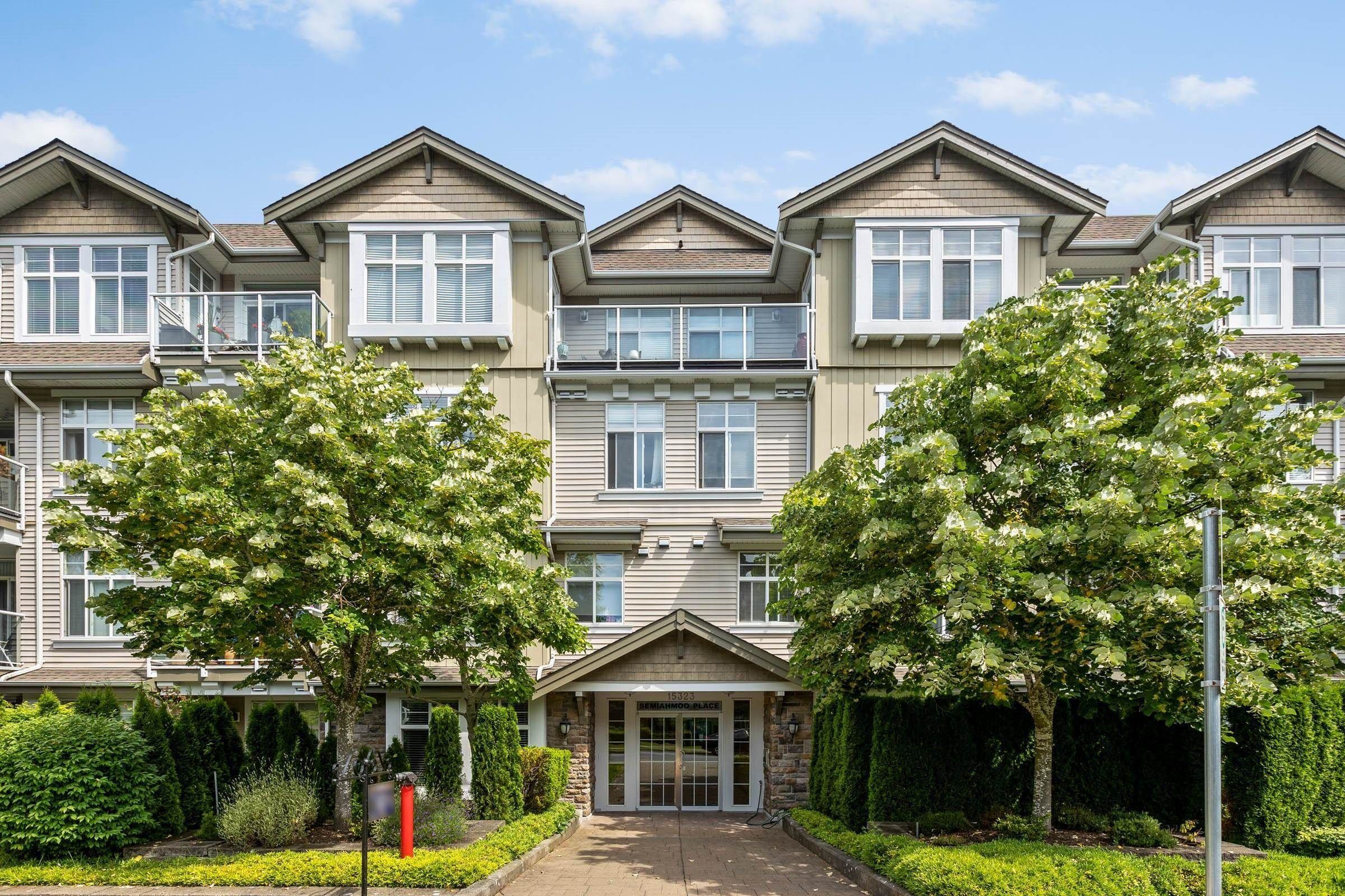 Main Photo: 404 15323 17A Avenue in Surrey: King George Corridor Condo for sale in "SEMIAMOO PLACE" (South Surrey White Rock)  : MLS®# R2822142
