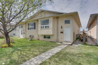Photo 2: 401 Martindale Boulevard NE in Calgary: Martindale Semi Detached (Half Duplex) for sale : MLS®# A2131850