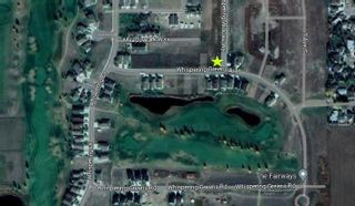 Photo 1: 602 Whispering Greens Avenue: Vulcan Residential Land for sale : MLS®# A2109223