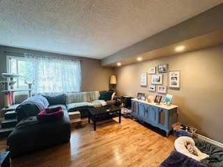 Photo 3: 210 1540 29 Street NW in Calgary: St Andrews Heights Row/Townhouse for sale : MLS®# A2136621