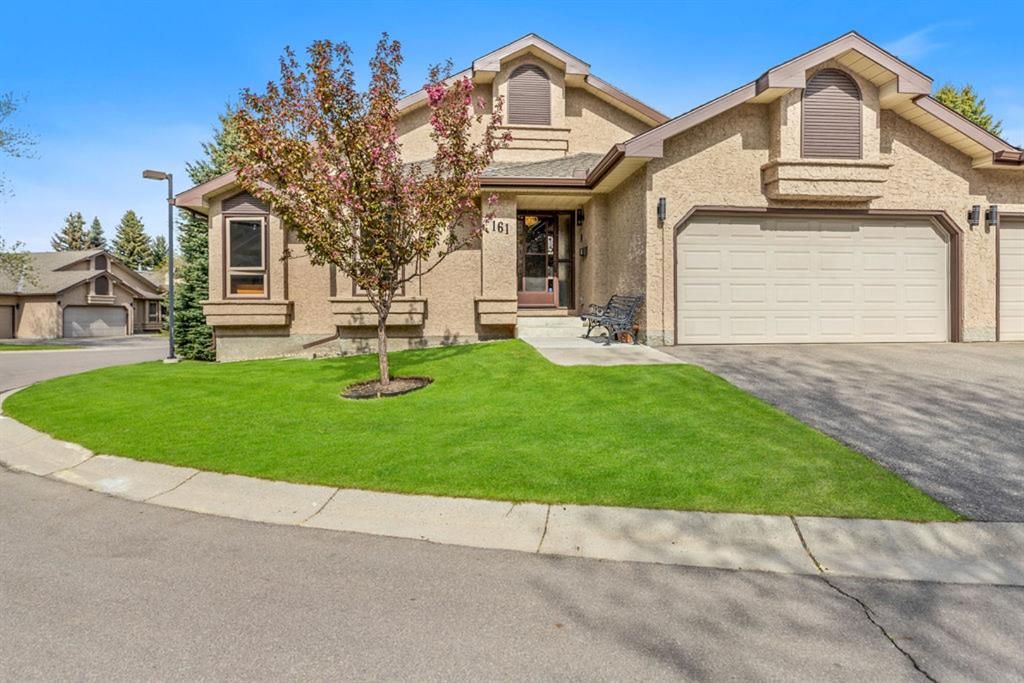 Main Photo: 161 Oakbriar Close SW in Calgary: Palliser Row/Townhouse for sale : MLS®# A1224184