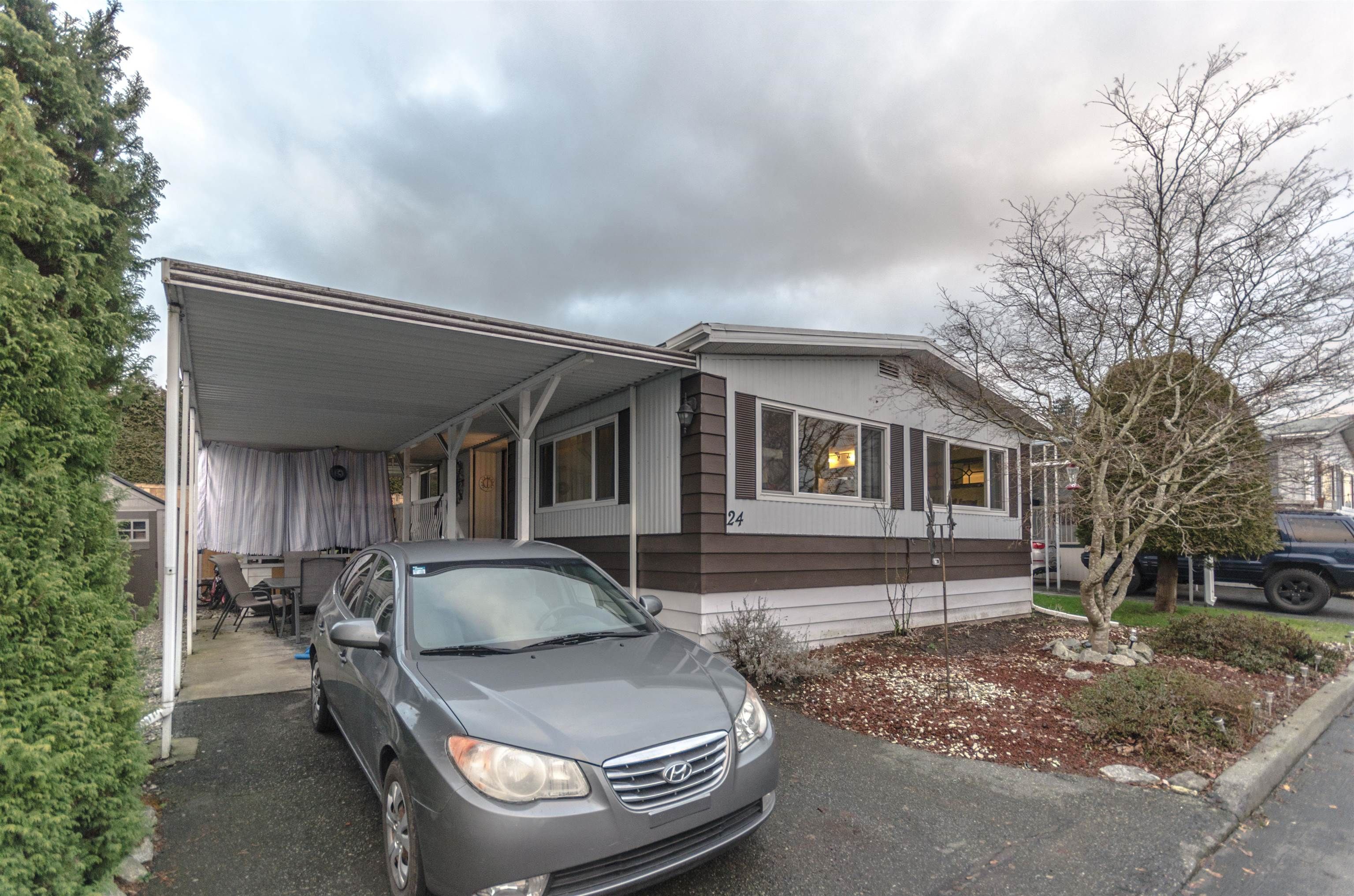 Main Photo: 24 8254 134 Street in Surrey: Queen Mary Park Surrey Manufactured Home for sale : MLS®# R2653909