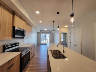 Photo 2: 1201 42 Cranbrook Gardens SE in Calgary: Cranston Apartment for sale : MLS®# A2047950