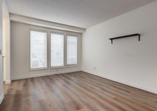 Photo 8: 26 Mike Ralph Way SW in Calgary: Garrison Green Row/Townhouse for sale : MLS®# A2047049