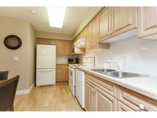 Photo 8: 225 13880 70 Avenue in Surrey: East Newton Condo for sale in "Chelsea Gardens- The Windsor Building" : MLS®# R2398385