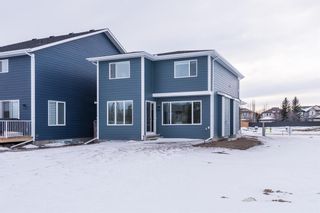 Photo 4: 66 Westmore Park SW in Calgary: West Springs Detached for sale : MLS®# A1065787