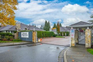 Photo 2: 10 21746 52 Avenue in Langley: Murrayville Townhouse for sale in "Glenwood Village" : MLS®# R2736717