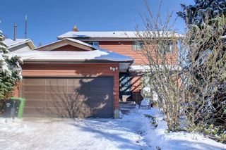 Photo 1: 32 Coach Manor Rise SW in Calgary: Coach Hill Detached for sale : MLS®# A2011473