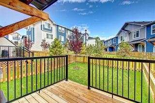 Photo 1: 1804 Jumping Pound Common: Cochrane Row/Townhouse for sale : MLS®# A2045735
