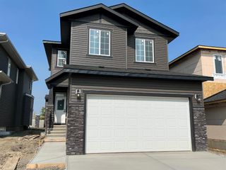 Photo 1: 134 Creekside Way SW in Calgary: C-168 Detached for sale : MLS®# A2002352