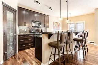 Photo 6: 325 BRIDLERIDGE View SW in Calgary: Bridlewood House for sale : MLS®# C4177139