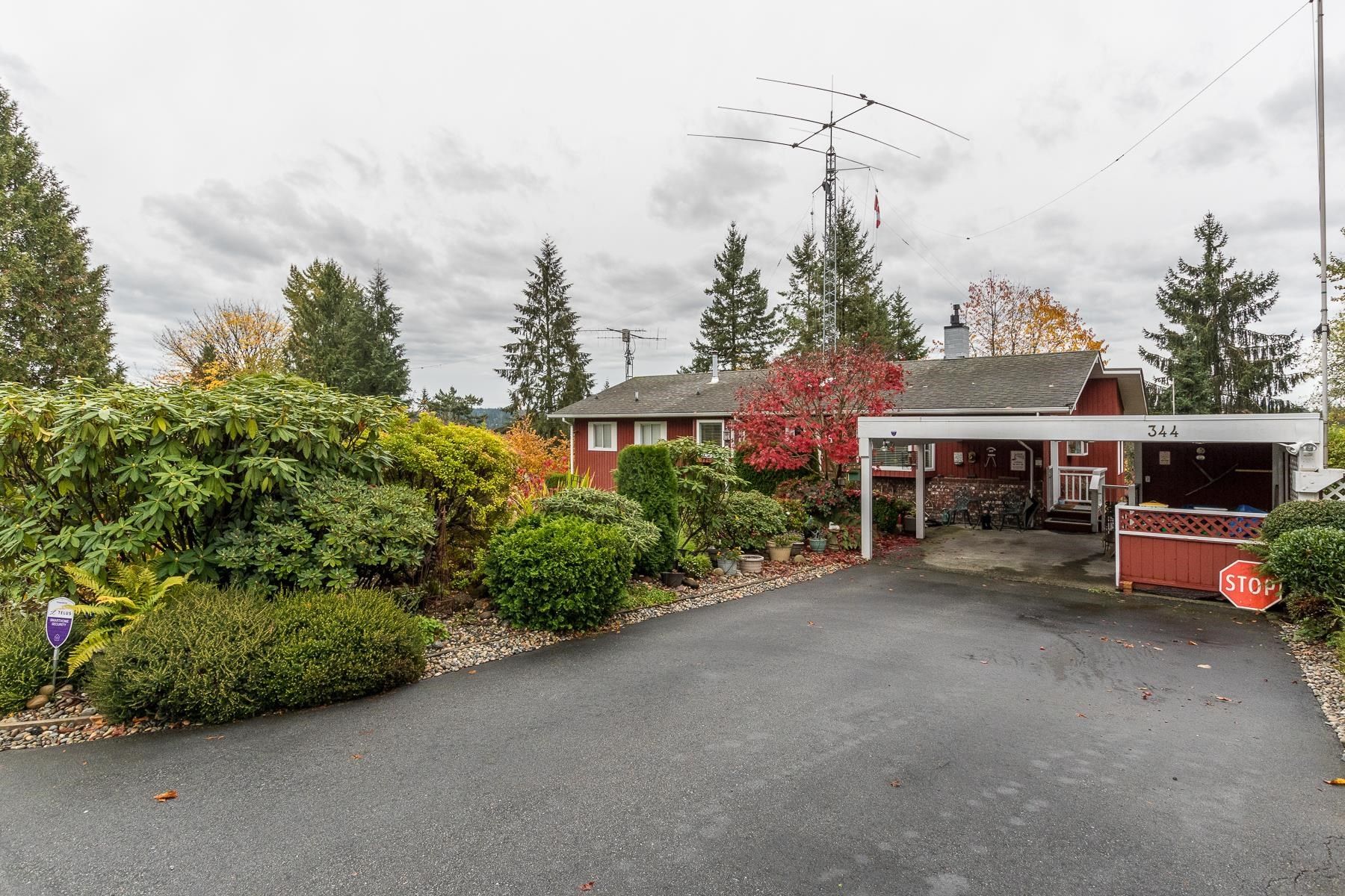 Photo 1: Photos: 344 OXFORD Drive in Port Moody: College Park PM House for sale : MLS®# R2631016