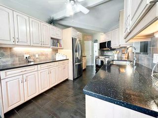 Photo 11: 4504 Claret Street NW in Calgary: Charleswood Detached for sale : MLS®# A2044128