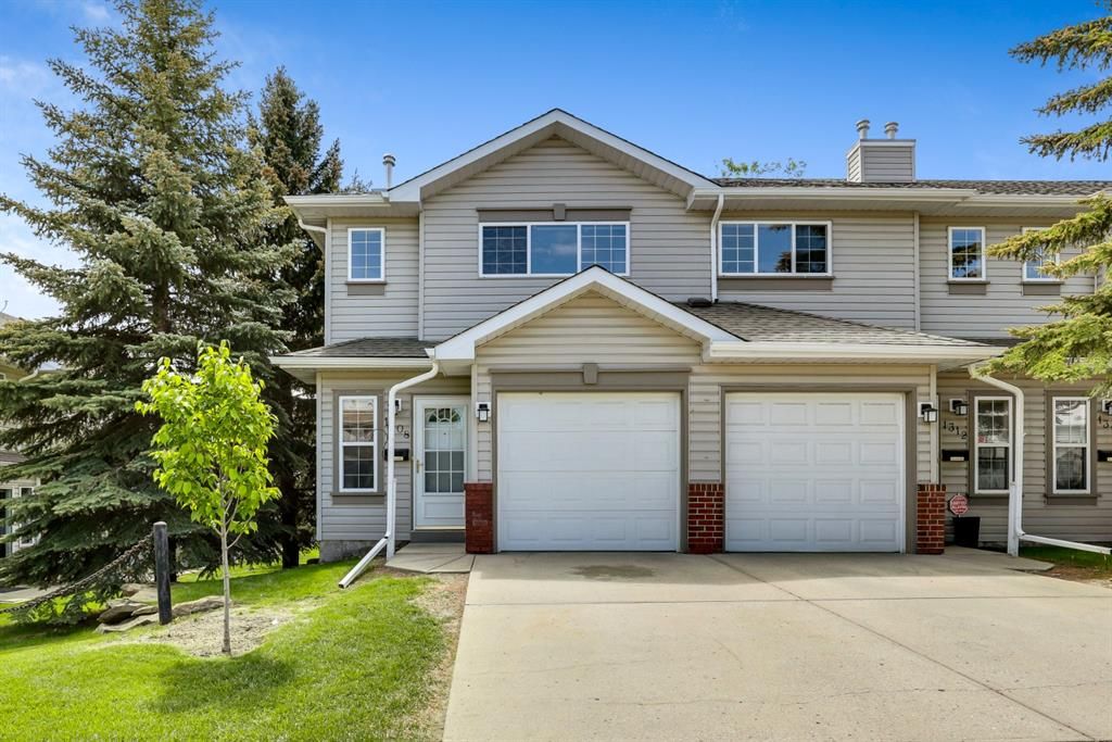 Main Photo: 1308 154 Avenue SW in Calgary: Millrise Row/Townhouse for sale : MLS®# A1227689