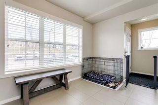 Photo 3: 304 Ascot Circle SW in Calgary: Aspen Woods Row/Townhouse for sale : MLS®# A1217542