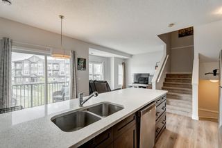 Photo 1: 413 250 Fireside View: Cochrane Row/Townhouse for sale : MLS®# A2052026