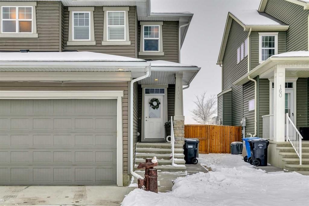 Main Photo: 164 Evansglen Close NW in Calgary: Evanston Semi Detached (Half Duplex) for sale : MLS®# A2106102