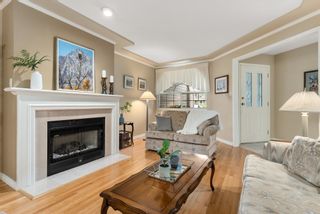 Photo 3: 6119 W BOUNDARY Drive in Surrey: Panorama Ridge Townhouse for sale in "Lakewood Gardens" : MLS®# R2725303