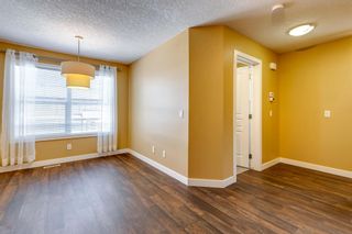 Photo 5: 101 Panatella Road NW in Calgary: Panorama Hills Row/Townhouse for sale : MLS®# A2030502