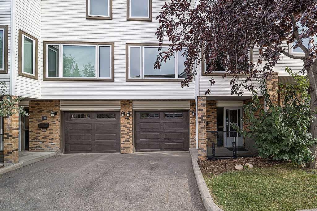 Main Photo: 220 Coachway Lane SW in Calgary: Coach Hill Row/Townhouse for sale : MLS®# A2080348