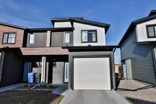 Photo 1: 7 414 Highlands Boulevard W: Lethbridge Row/Townhouse for sale : MLS®# A2115446