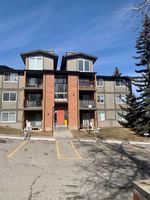 Main Photo: 211 6400 Coach Hill Road SW in Calgary: Coach Hill Apartment for sale : MLS®# A2115311