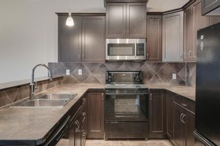 Photo 4: 48 Arbours Circle NW: Langdon Row/Townhouse for sale : MLS®# A1045296