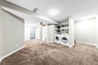 Photo 17: 13 Woodhill Court SW in Calgary: Woodlands Row/Townhouse for sale : MLS®# A1209374