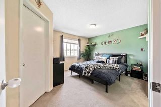 Photo 13: 103 Tuscany Springs Gardens NW in Calgary: Tuscany Row/Townhouse for sale : MLS®# A2129960