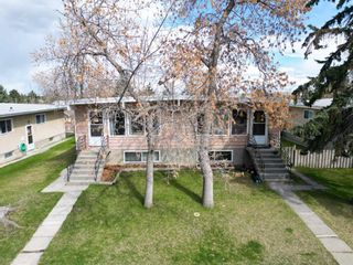Main Photo: 7110 - 7112 Hunterville Road NW in Calgary: Huntington Hills Full Duplex for sale : MLS®# A2135600