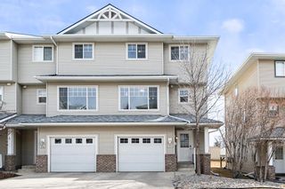 Photo 1: 76 Crystal Shores Cove: Okotoks Row/Townhouse for sale : MLS®# A1192998