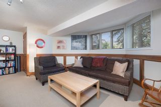 Photo 32: 311 Coach Light Bay SW in Calgary: Coach Hill Detached for sale : MLS®# A2002030