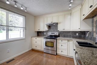 Photo 10: 625 Queensland Place SE in Calgary: Queensland Row/Townhouse for sale : MLS®# A2051134