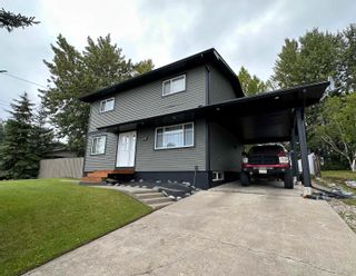 Photo 1: 218 CENTENNIAL Drive in Mackenzie: Mackenzie -Town House for sale : MLS®# R2802212