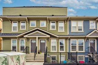 Photo 1: 128 Cranbrook Square SE in Calgary: Cranston Row/Townhouse for sale : MLS®# A1232257