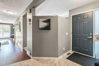 Photo 4: 49 Stradwick Place SW in Calgary: Strathcona Park Semi Detached (Half Duplex) for sale : MLS®# A2082452