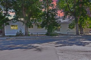 Photo 1: 327-329 51 Avenue W: Claresholm Full Duplex for sale : MLS®# A2016382