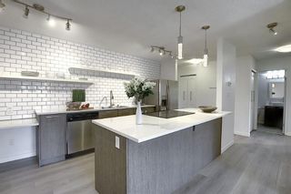 Photo 1: 203 809 4 Street NE in Calgary: Renfrew Apartment for sale : MLS®# A2118564
