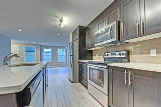 Photo 4: 1002 2400 Ravenswood View SE: Airdrie Row/Townhouse for sale : MLS®# A1214119