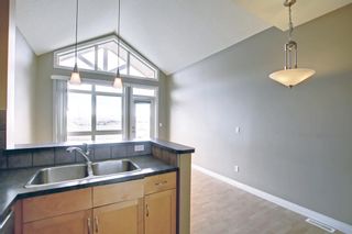 Photo 14: 14 140 Rockyledge View NW in Calgary: Rocky Ridge Row/Townhouse for sale : MLS®# A1199471