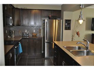 Photo 4: 64 WINDSTONE Green SW: Airdrie Townhouse for sale : MLS®# C3566494