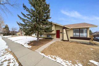 Photo 1: 580 Strathcona Drive SW in Calgary: Strathcona Park Semi Detached for sale : MLS®# A1191332