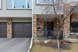 Photo 1: 306 Coachway Lane SW in Calgary: Coach Hill Row/Townhouse for sale : MLS®# A1211202