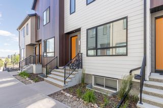 Photo 1: 320 Redstone Crescent NE in Calgary: Redstone Row/Townhouse for sale : MLS®# A1243729