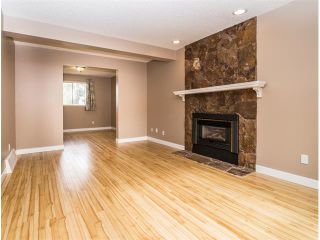 Photo 6: 1240 MEADOWBROOK Drive SE: Airdrie House for sale : MLS®# C4031774